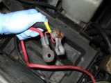 Crusty, non-original side-post terminals, courtesty of the previous owner who used the wrong battery, subsequently making a paperweight out of the stock hold-down clamp.