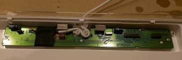 Reinstall the PCB. Locate the PCB properly in the well, then reinstall the four screws removed previously. Route the USB cable as it was routed previously around the strain-relief bosses.