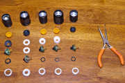 Tailcap compare-o, exploded-view version! From left to right: stock later-version L2P, S5, S6, S8, S10.