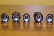 Tailcap compare-o, internal view! From left to right: stock late-version L2P, S5, S6, S8, S10.